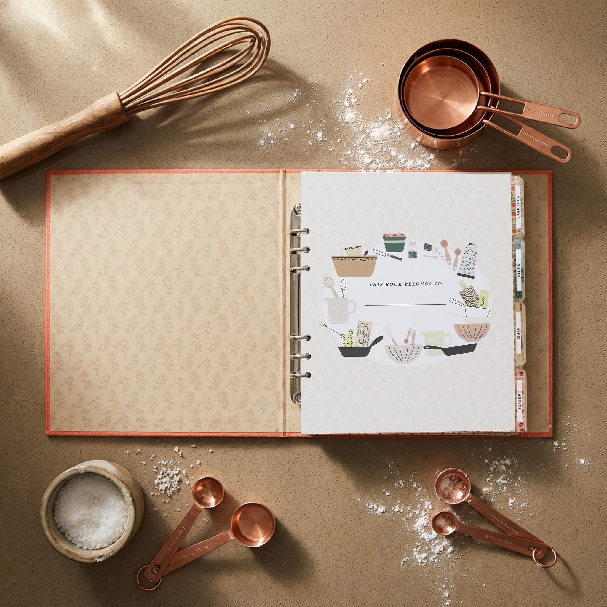 Cooking Together recipe book red coral - copper measuring cups and whisk flatlay