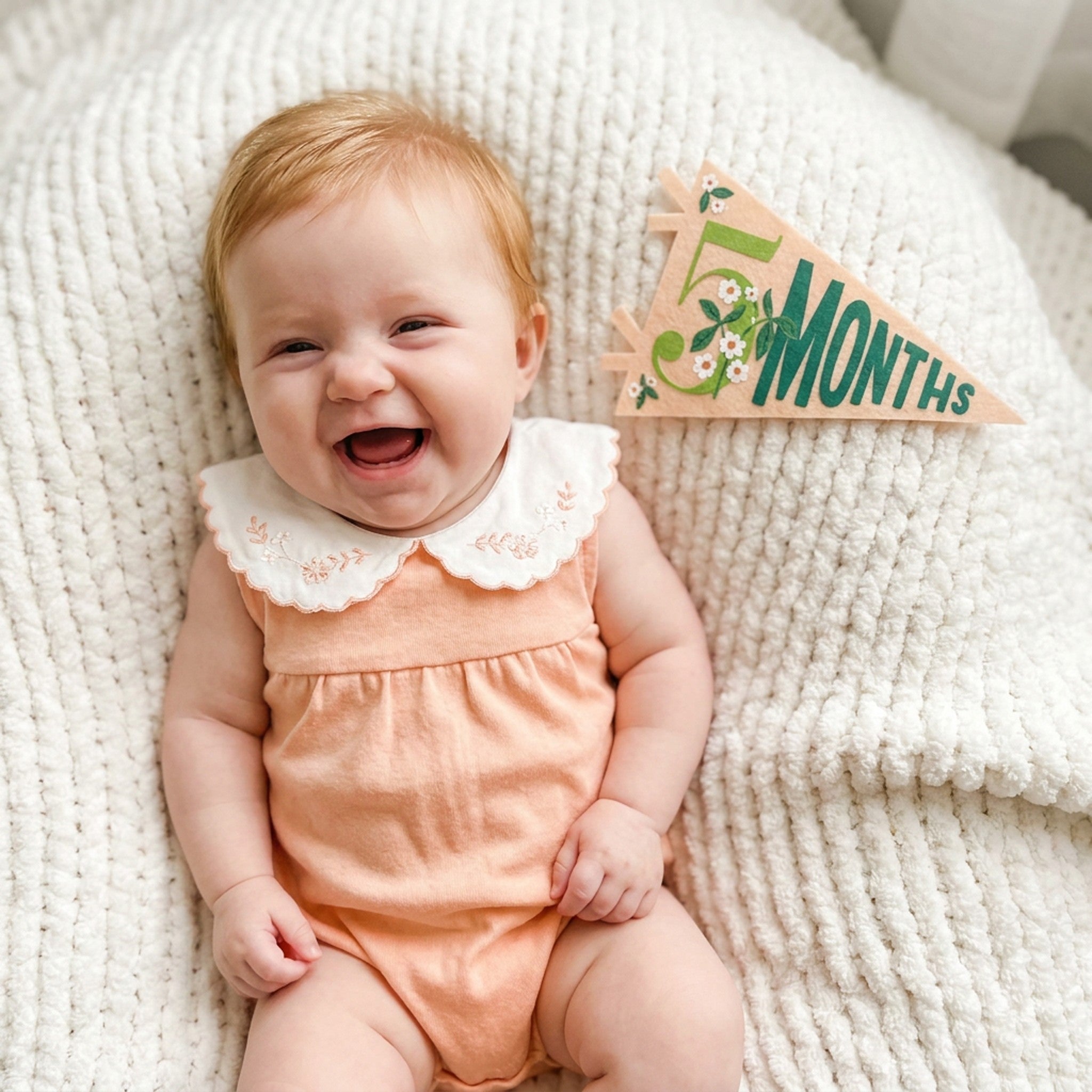 5-month milestone photo with Little Artist pennant