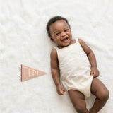 10-month milestone photo with Mountain Fields pennant